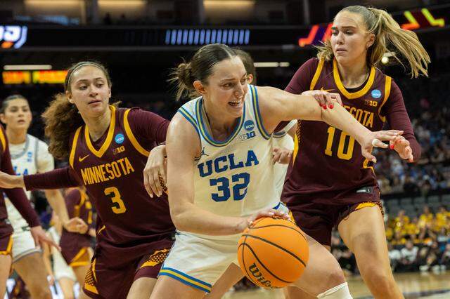 UCLA Bruins forward Angela Dugalic drives against Minnesota Golden Gophers guard Mara Braun (10) during the NCAA Women’s Basketball Tournament Sweet 16 game at Golden 1 Center in Sacramento on Friday.